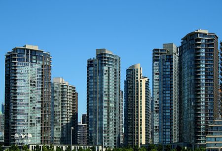 modern residential and commercial buildings under a clear blue sky