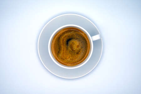 Cup of black coffee with saucer, white background, top view
