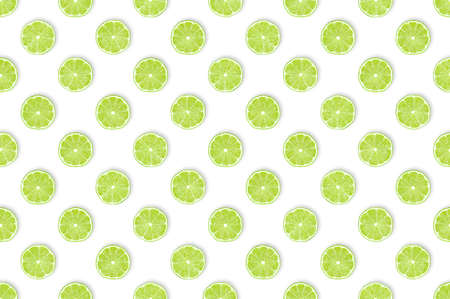 Green vitamin bomb for bars and kitchens: Pattern of freshly cut lime slices against white background. Healthy fruit concept, table top view, flat lay.の写真素材