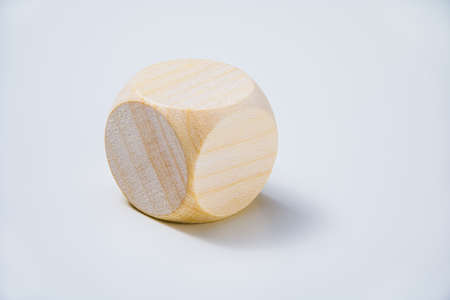 Gambling or rolling the dice concept. Blank wooden dice with copy space on white background.の写真素材