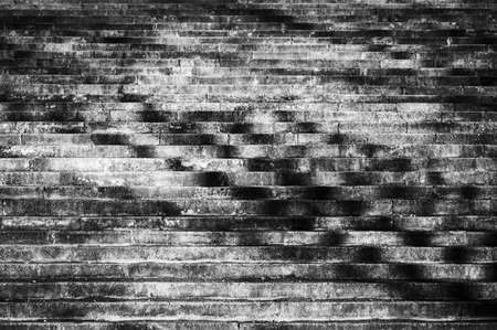 Stone steps in the evening sun. Weathered staircase on which bare trees cast their shadows.の写真素材