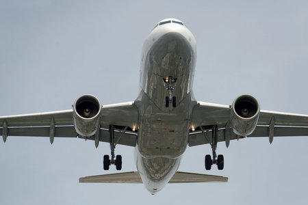 The underside of a modern airplane and its landing gearの写真素材