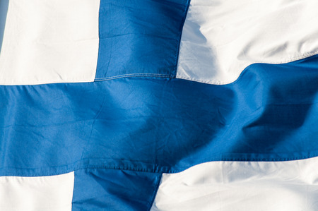 The flag of Finland waving in the windの写真素材