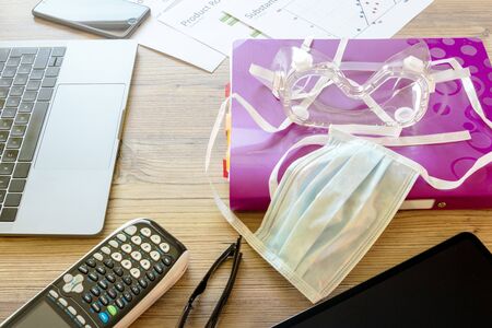 Office and safety equipment on a wooden tableの写真素材