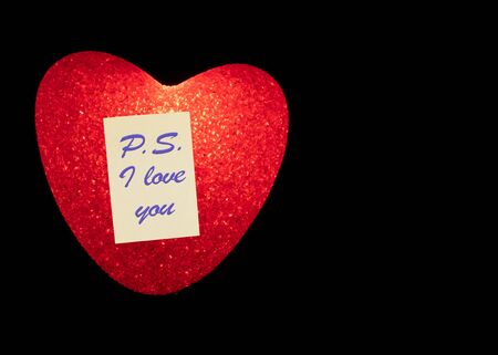 Illuminated red heart with the text PS I LOVE YOUの写真素材