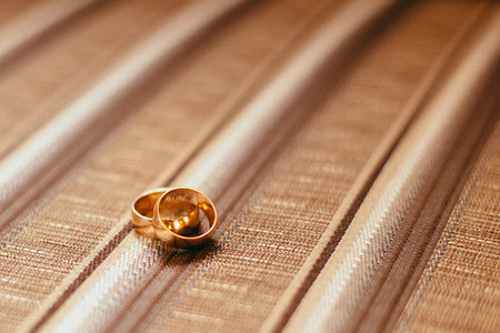 Wedding rings on a beige fabric. close-up.