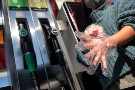 Single-use gloves provided in gas station increases exponentially  world contaminationの写真素材