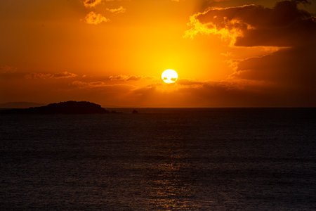 Amazing sunset over the Atlantic Ocean and some clouds aroundの写真素材