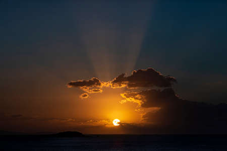 Amazing sunset over the Atlantic Ocean and some clouds aroundの写真素材