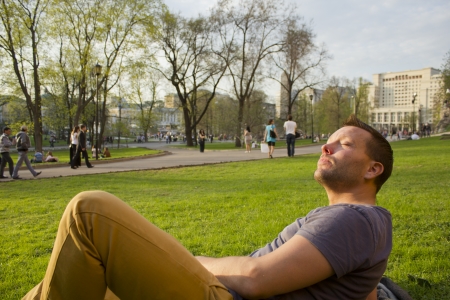 Handsome man on the grassの写真素材