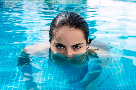 Girl resting in swimming pool at the Caribbeanの写真素材