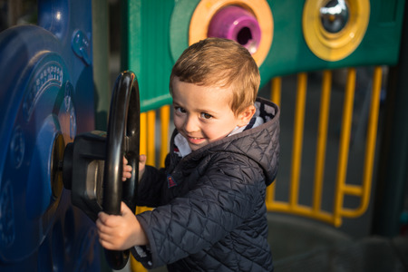 happy little boy on the playground.の写真素材
