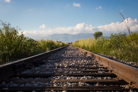 Railroad sunset, mountains and blue sky.の写真素材