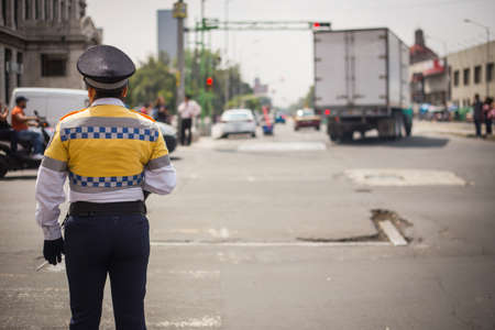 Traffic cop checking the traffic in mexico city.の写真素材