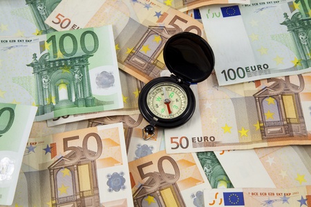 euro banknotes and compassの写真素材