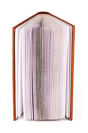 Semi open book with a hardcover on a white background.の写真素材