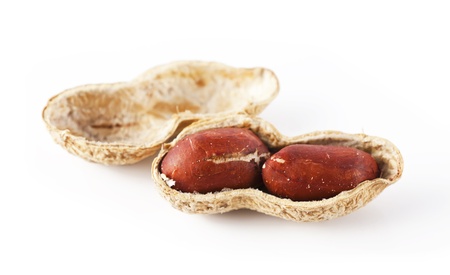 Peanut shells and two peanut kernel, on a white background 