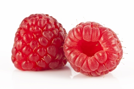 Two fresh juicy raspberries on white background 
