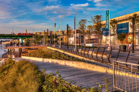 SERBIA, BELGRADE - SEPTEMBER 13: Promenade on Sava on September 13, 2017 in Belgrade. New terraces on Sava Promenade and Brankoâs Bridge in the distance. HDR Image.のeditorial素材