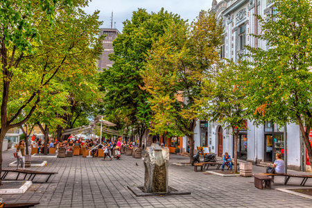 SERBIA, BELGRADE - SEPTEMBER 19: Cvetni trg on September 19, 2017 in Belgrade. Cafes and shops on the square and buildings Beogradjanka in the distance. HDR Image.のeditorial素材
