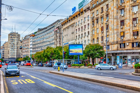 SERBIA, BELGRADE â SEPTEMBER 19: Square Terazije on September 19, 2017 in Belgrade. Traffic on the square, shops, buildings and palace Albania in the distance, HDR Image.のeditorial素材