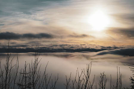 View from above the clouds with sunset from top of the mountainの写真素材
