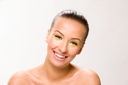 Brown sleek hair beautiful woman with with skin lips looking at camera.の写真素材