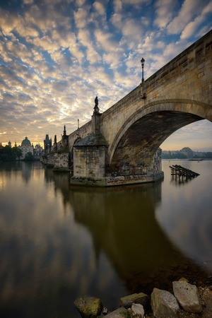 Charles bridge reflection during sunrise, Prague, Czech republicの写真素材