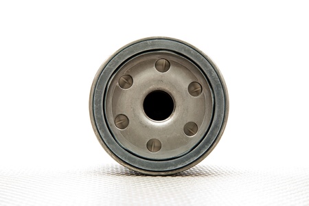 car oil filter over white backgroundの写真素材