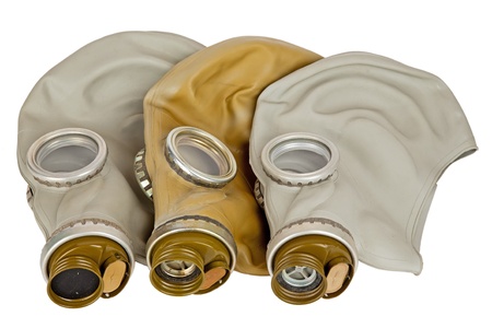 three old military gas mask isolated on whiteの写真素材