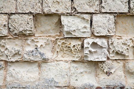 old wall destroyed by the impact of atmospheric phenomenaの写真素材