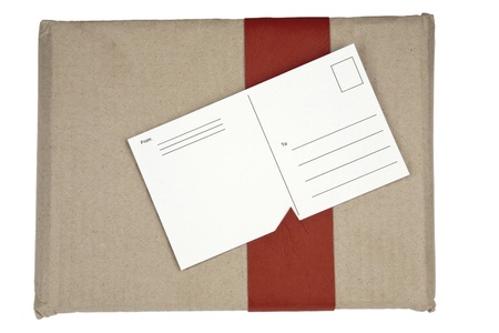 small package together with the attached post cardの写真素材