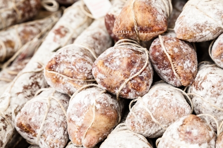 Italian specialties offered for sale at the marketの写真素材