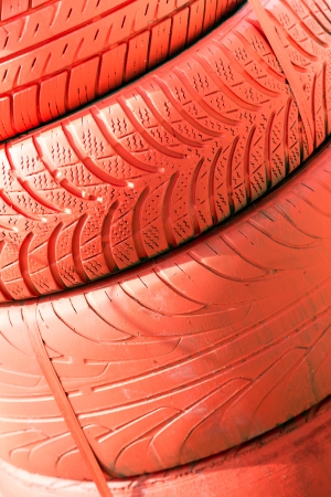 A pile of old tires painted redの写真素材
