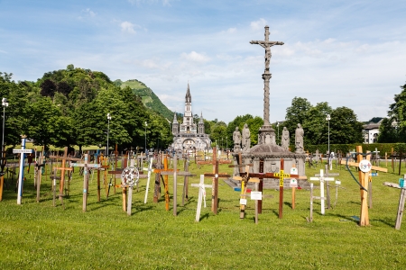 LOURDES â JUN 06  The Basilica of our Lady of the Rosary on June 06, 2011 in Lourdes in France  Garden of crosses in front of the Basilica のeditorial素材