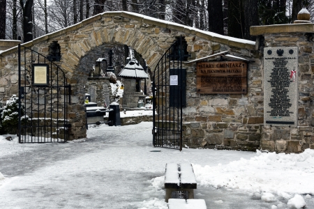 ZAKOPANE - JANUARY 06: Main Gate to old cemetery Na Peksowym Brzyzku of the nineteenth century in Zakopane in Poland on January 06, 2013. The cemetery the temple for meritorious people for Zakopane.のeditorial素材