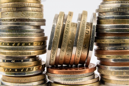 Edges of the stacked coins visible close upの写真素材