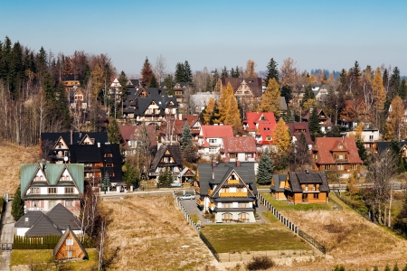 ZAKOPANE - AUGUST 11: Contemporary houses located between districts Antalowka and Koziniec usually offering hospitality rooms for many tourists in Zakopane in Poland on August 11, 2011.のeditorial素材