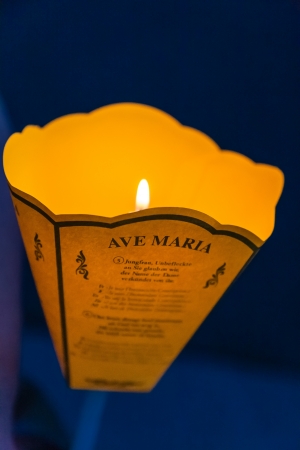 LOURDES - JUN 05: lantern with a candle at evening daily procession from the Grotto to the front of Basilica of the Rosary and the faithful sing the song Ave Maria in Lourdes, France on June 05, 2012のeditorial素材