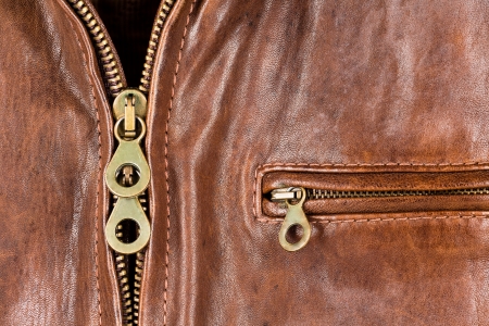 Closeup of leather jacket shows the zipper and the pocketの写真素材