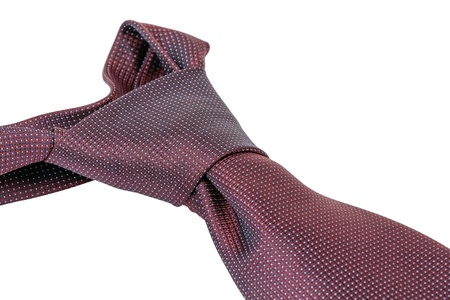 Closeup of a knotted man's necktie on whiteの写真素材