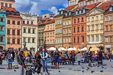 WARSAW - April 13: Unidentified tourists on the market of the Old Town which was completely destroyed during the World War II and rebuilt in the years 1949-1953 in Warsaw, Poland  on April 13, 2013のeditorial素材