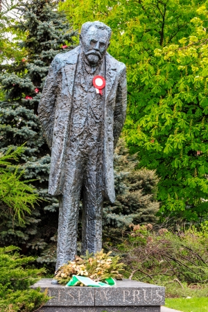 WARSAW - MAY 04: Boleslaw Prus Statue, 3.6 m high, designed by Anna Kamienska-Lapinska, on the occasion of the flag day (May 02), decorated with the national colors in Warsaw, Poland on May 04, 2013のeditorial素材