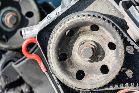 Camshaft pulley is shown in the example of the old damaged engine