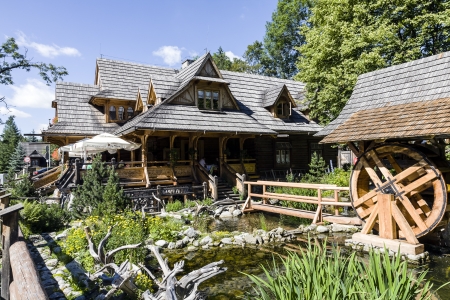 ZAKOPANE - JULY 21: \"Przy Mlynie\" wooden restaurant made up of elements derived from the year 1923 B & B Wlodek and originating in the year 1904 highland cottage in Zakopane in Poland on July 21, 2013のeditorial素材