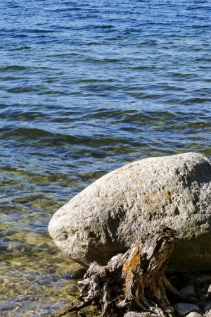 A boulder in waters of Hancza lake in Polandの写真素材