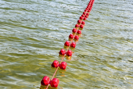 Plastic rope with buoys for safe swimming boundaryの写真素材