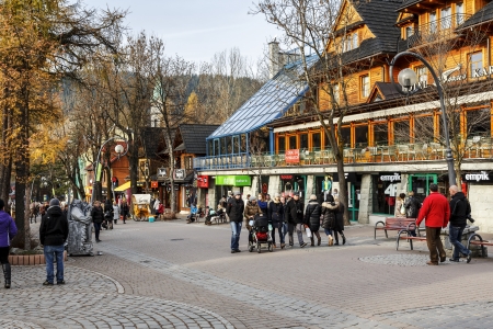ZAKOPANE - NOVEMBER 16  Unidentified tourists visits at the Krupowki next to Sabala Hotel, the main shopping area and pedestrian promenade in the city center  in Zakopane, Poland on November 16, 2013のeditorial素材