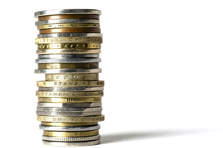 Various coins of different colors, of different sizes  arranged in stack