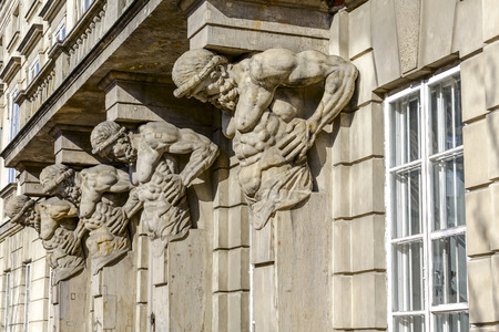 WARSAW, POLAND - MARCH 14, 2014  Four stone statues, carved in 1787 by Andre Le Brun supports the...